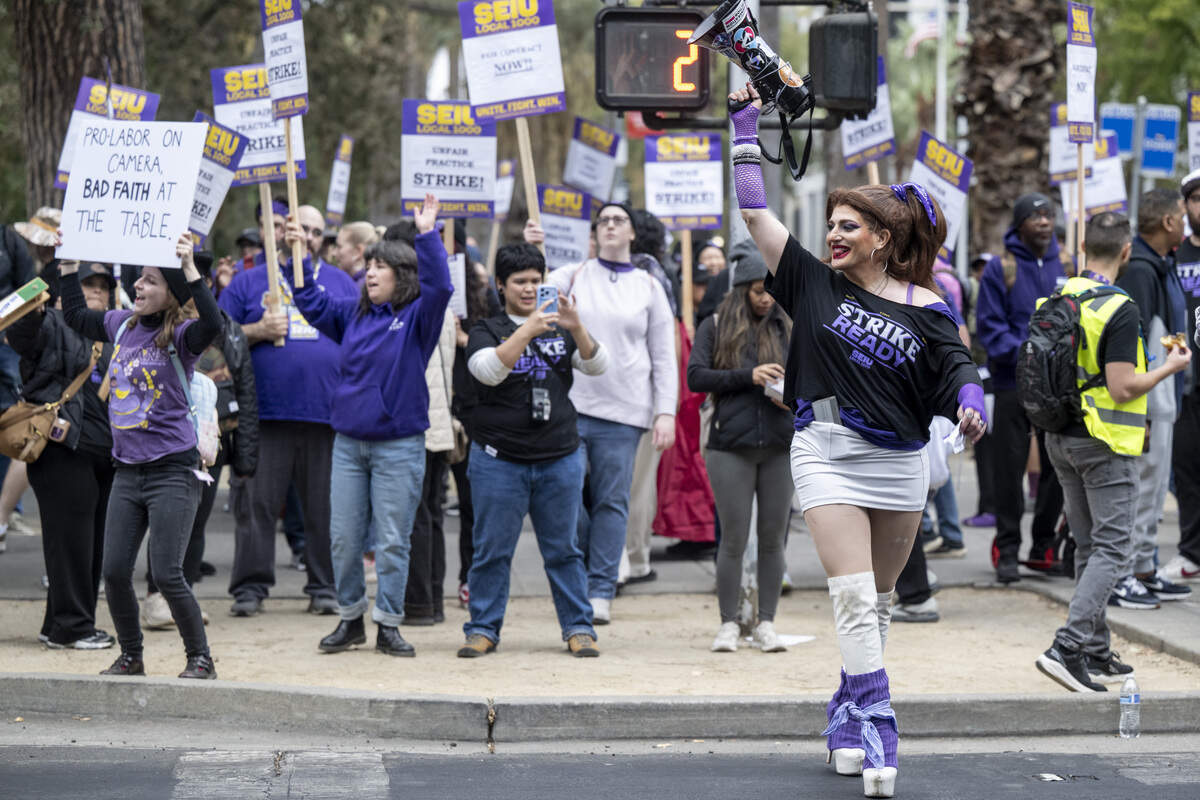 Suzette Veneti joins the picket lines as SEIU 1000 members strike outside the California Department of Education Headquarters in Sacramento on Wednesday, Oct. 21, 2026.